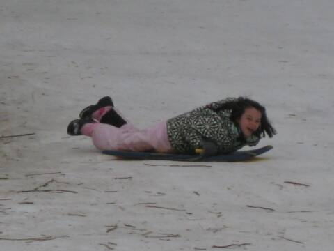 Girl sledding