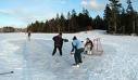 Playing hockey on pond